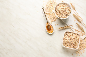 Oat flakes with honey on light table