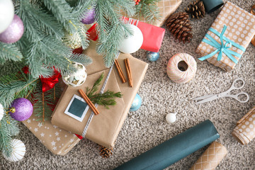 Fototapeta premium Beautiful Christmas gifts under fir tree, top view