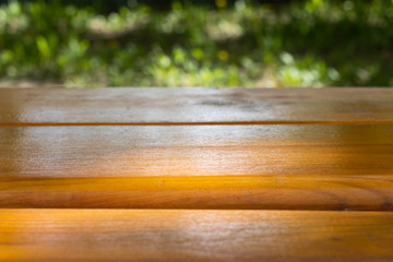 Empty wooden surface and blurred summer background. Template mock up for display of product.