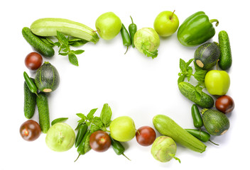 Frame made of fresh vegetables on white background