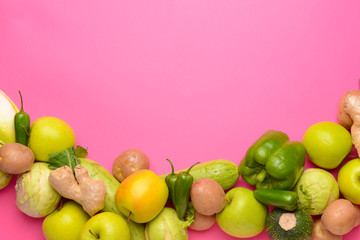 Assortment of fresh vegetables on color background