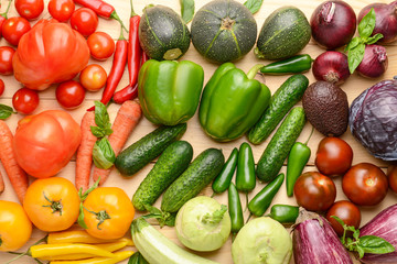 Assortment of fresh vegetables on wooden background