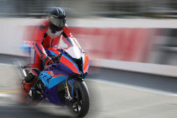 Motorcycle racing on speed track