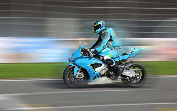 Motorcycle rider racing on race track