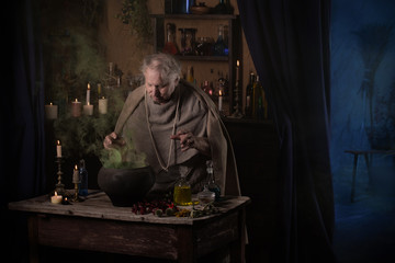 elderly alchemist monk brews  magic potion