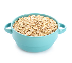 Pot with raw oatmeal on white background