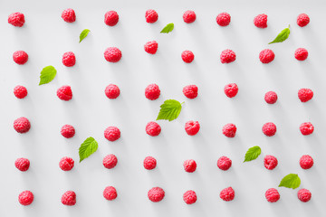 Tasty ripe raspberries on white background