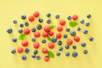 Tasty ripe berries on color background