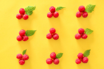 Tasty ripe raspberries on color background