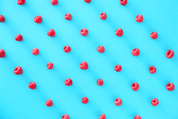 Tasty ripe raspberries on color background