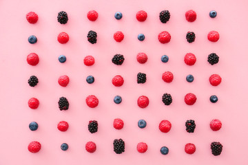 Tasty ripe berries on color background