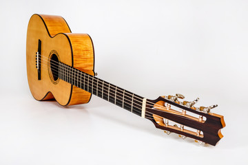 wood texture of lower deck of six strings acoustic guitar on white background. guitar shape