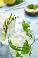 Glass of fresh mojito on table