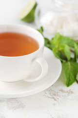 Cup of hot tea on table