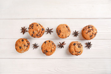 Fototapeta na wymiar Tasty cookies with chocolate chips on light wooden background