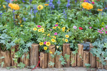 Wooden fence in beautiful backyard flower garden
