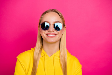 Closeup photo of nice lady wear sun specs yellow hoodie pullover isolated pink background