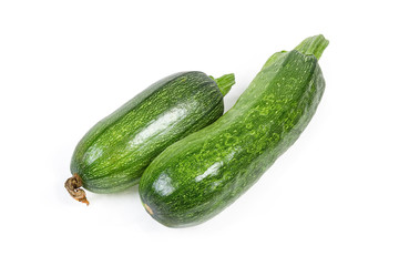 Two green zucchini on a white background