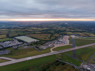 Aerial photo of the famous Leeds and Bradford airport located in the Yeadon area of West Yorkshire in the UK, typical British airport showing the runway and houses and roads around the airport