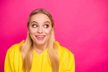 Closeup photo of nice lady look side empty space wear yellow hoodie pullover isolated pink background