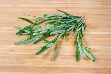 Bunch of fresh rosemary on a wooden surface