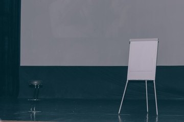 large white screen and flipchart in the conference room