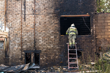 Firefighters extinguish a major fire in residential buildings