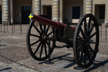 Old fashioned cannon with Sweden flag