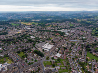 Aerial photo of the town known as Yeadon within the metropolitan borough of the City of Leeds, West Yorkshire, England, showing typical British houses, roads and streets with fields close by.
