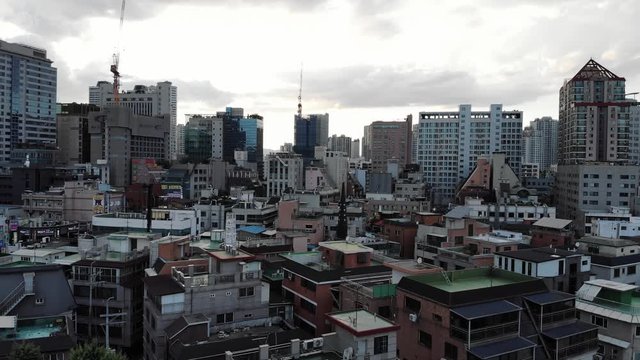 Drone Aerial footage of Seoul, South Korea - Jamsil Area - Traffic buildings, lake, and people