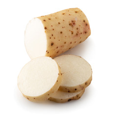 Yamaimo roots and slices or Chinese yam isolated over white background