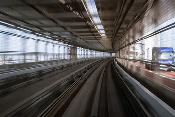 Obraz premium motion-blurred view from a moving train running in tunnel