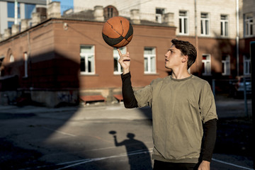 Basketball player spinning ball on his finger