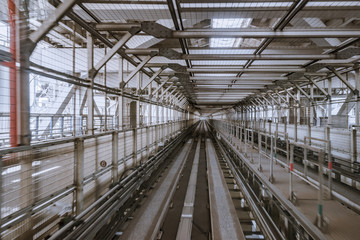tunnel of monorail road view from front window of a moving train running