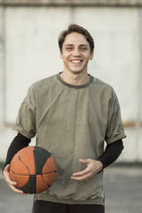 Front view happy man with a basketball