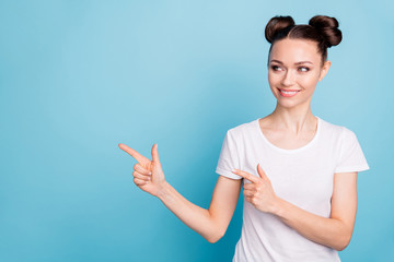 Funny lady indicating fingers empty space advising go shopping wear white casual t-shirt isolated...