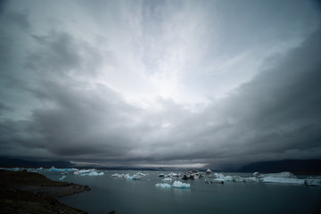 Fototapeta premium Fragments of iceberg in sea water. Iceland north sea