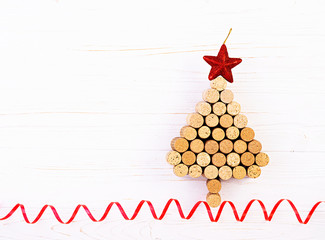 Christmas tree made of wine corks on white background. Mockup postcard with Christmas tree and copy space for text. Top view.