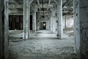 Large abandoned hall with columns