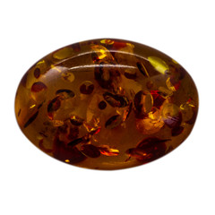 Natural cabochon of glossy manmade amber macro