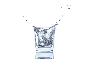 The ice cube splash into glass of water