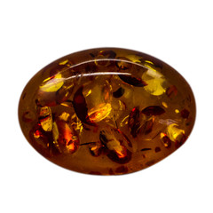 Natural cabochon of glossy manmade amber macro