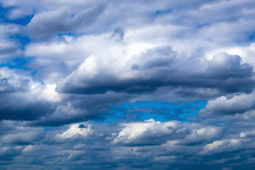 Obraz premium Storm clouds in the blue sky