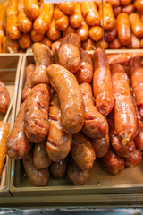 Close up photo of fried sausage at street food market