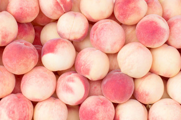 Many of juicy, ripe peaches. Background of peaches.