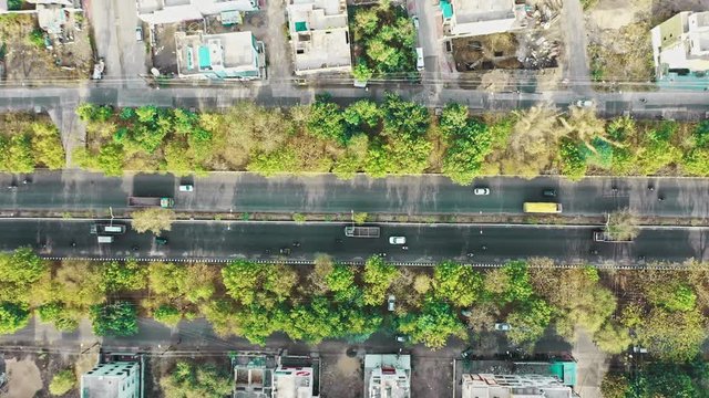 Aerial UHD drone footage of a road in urban city of India "Indore" which is also India's cleanest city .