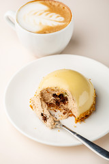 One dessert and cup of coffee