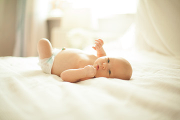 pretty newborn baby looking closely at the camera .