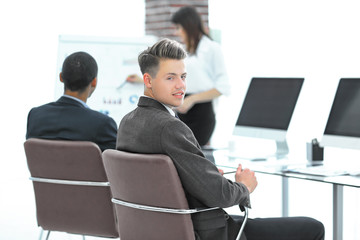employee of the company on the background of business team