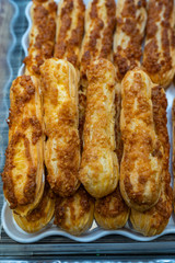 Close up photo of fresh baked choux pastry with caramel
